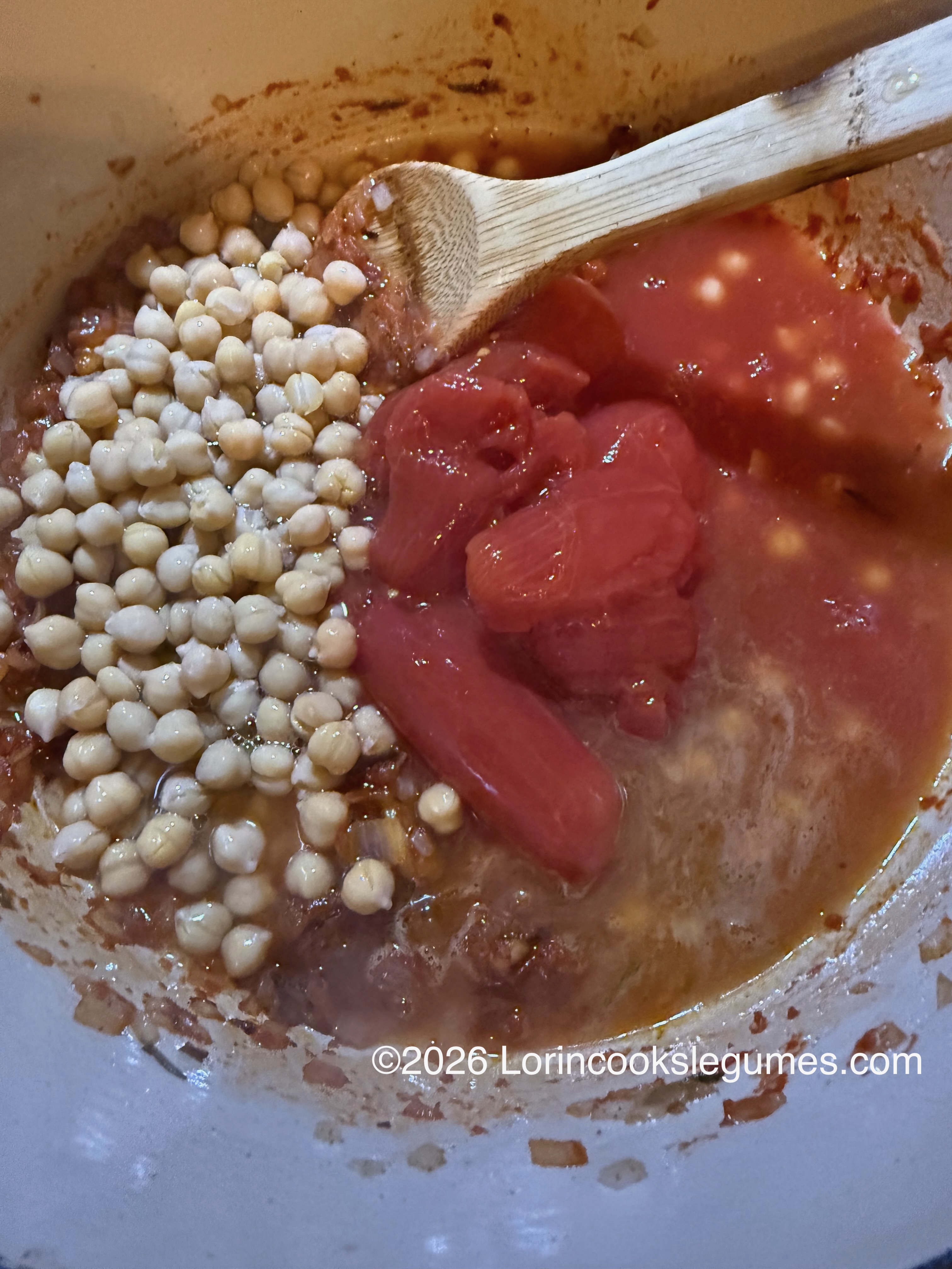 IMG_0222 A pot containing chickpeas and peeled tomatoes. ©2026 Lorincookslegumes.com