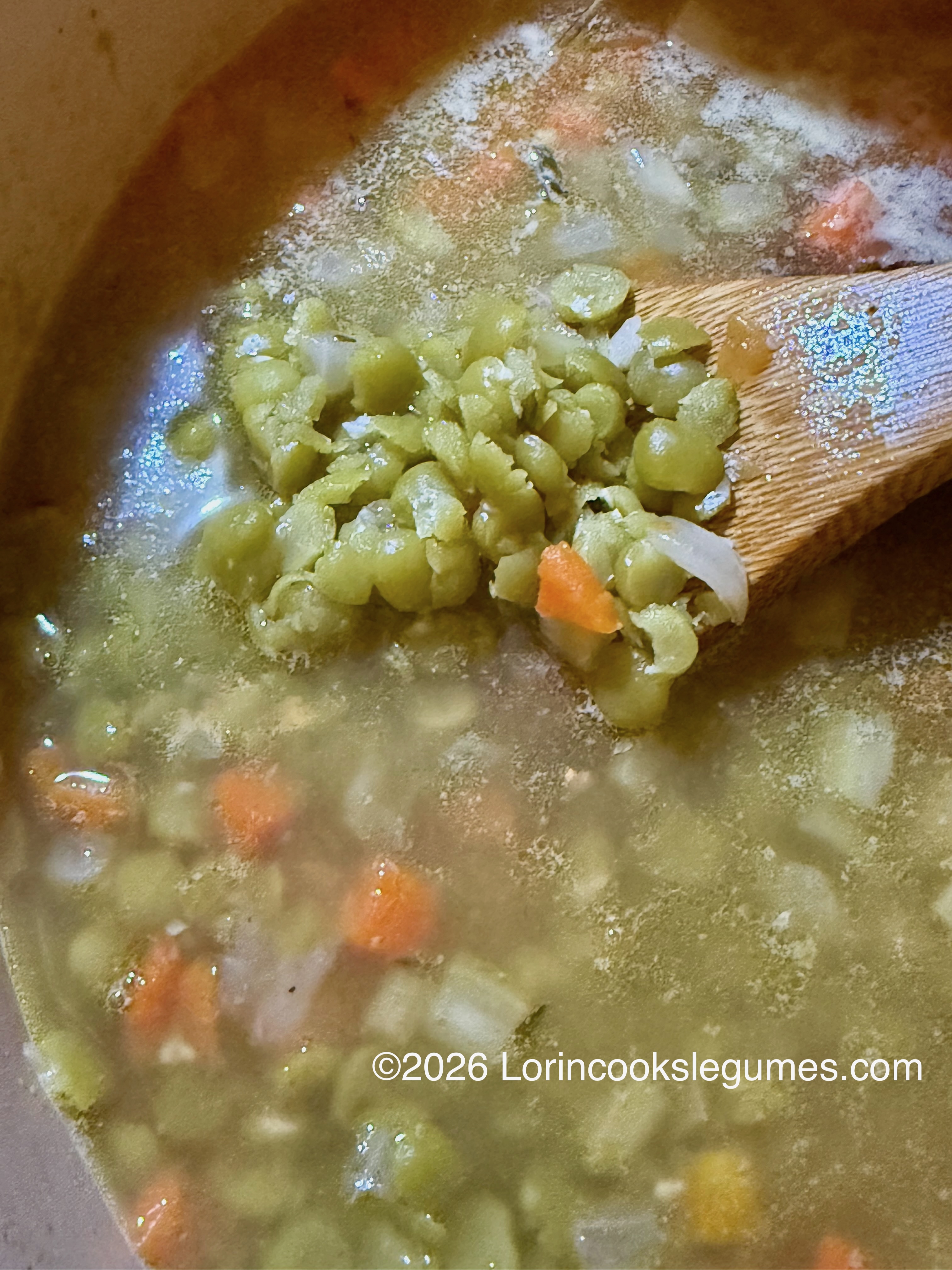 Close-up of cooked split peas with carrot and onion. ©2026 Lorincookslegumes.com